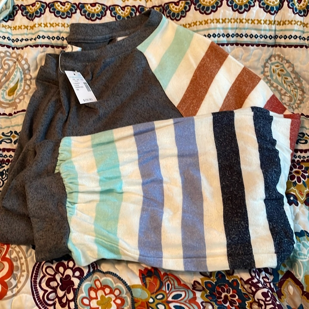 Maurice’s grey with rainbow stripe sleeves